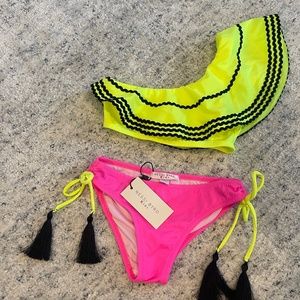 Nessi Byrd Two piece neon bikini with tassels